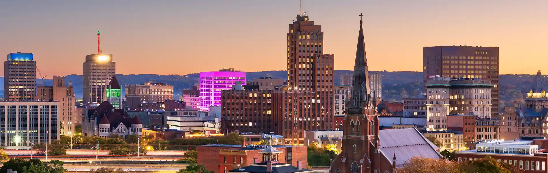 Neon color image of a band playing and people singing along