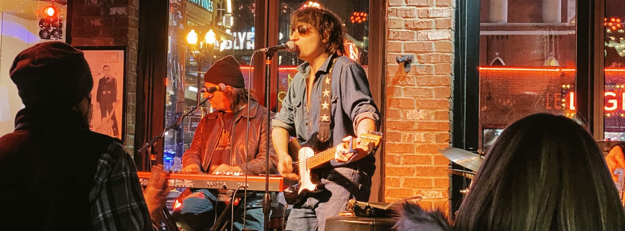 bar singer on guitar in Syracuse